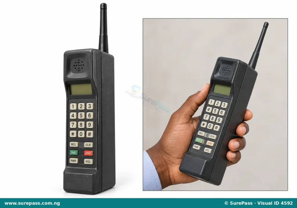 A large, bulky first mobile phone with an antenna.