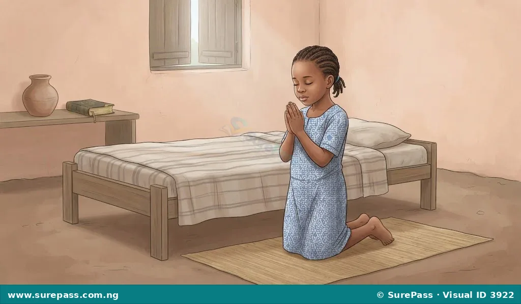 A child praying quietly beside their bed.
